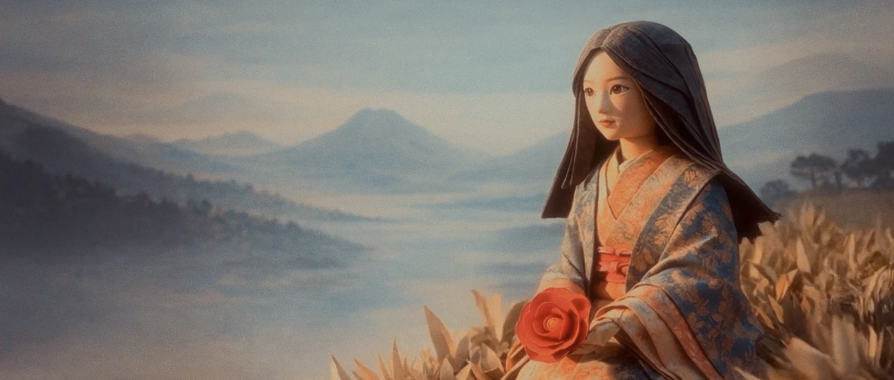 A woman holding a red flower beside a mountain lake