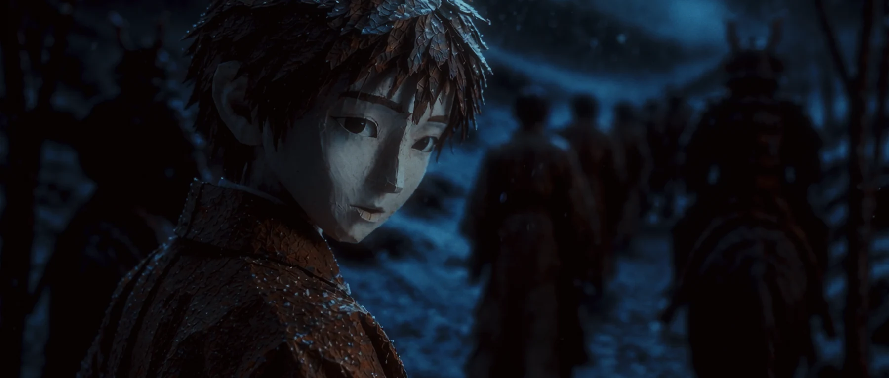 A young boy glances back during the night procession